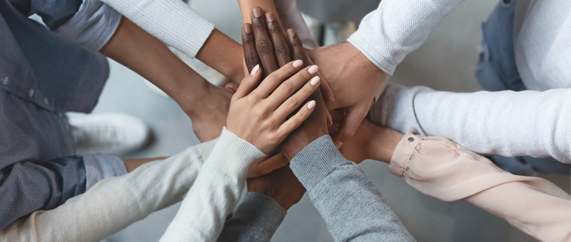 A picture of the hands of the team members of Luna Recovery for Women in North Andover, MA.